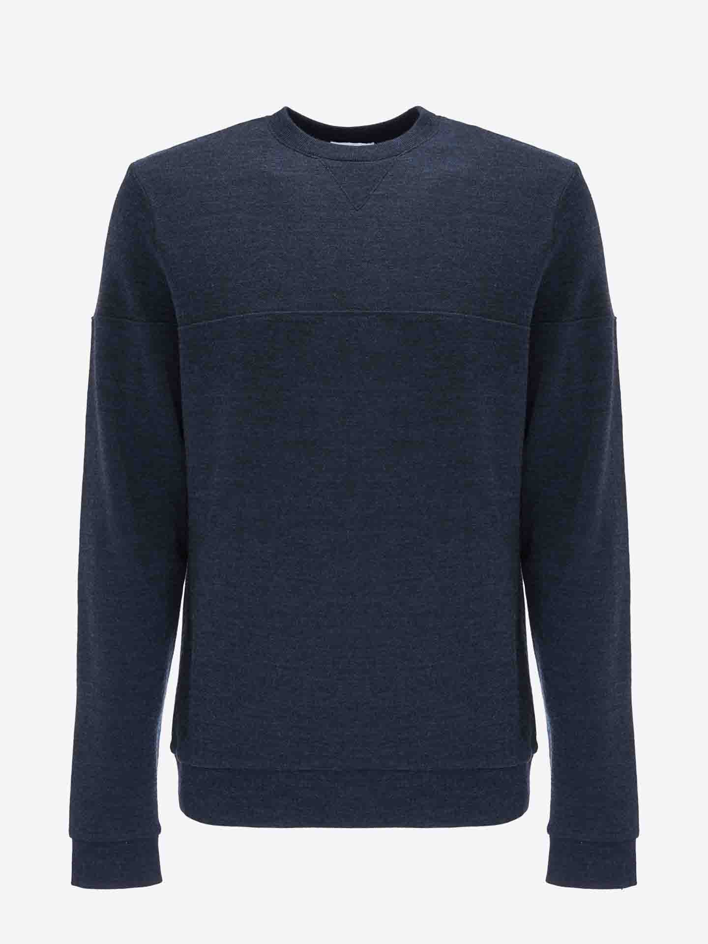 A plain navy blue crewneck sweatshirt with long sleeves, displayed against a white background. Made from cozy Merino wool, the Tind Crewneck Men by We Norwegians features a fitted design with ribbed cuffs, hem, and neckline‚Äîperfectly complementing your Tind Joggers for an effortlessly stylish sportswear look.