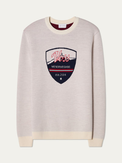 We Norwegians | FW25 | Mens Afterski Crewneck_Cream | A knitted sweater with a motif and logo at the front | Shot against an off-white background