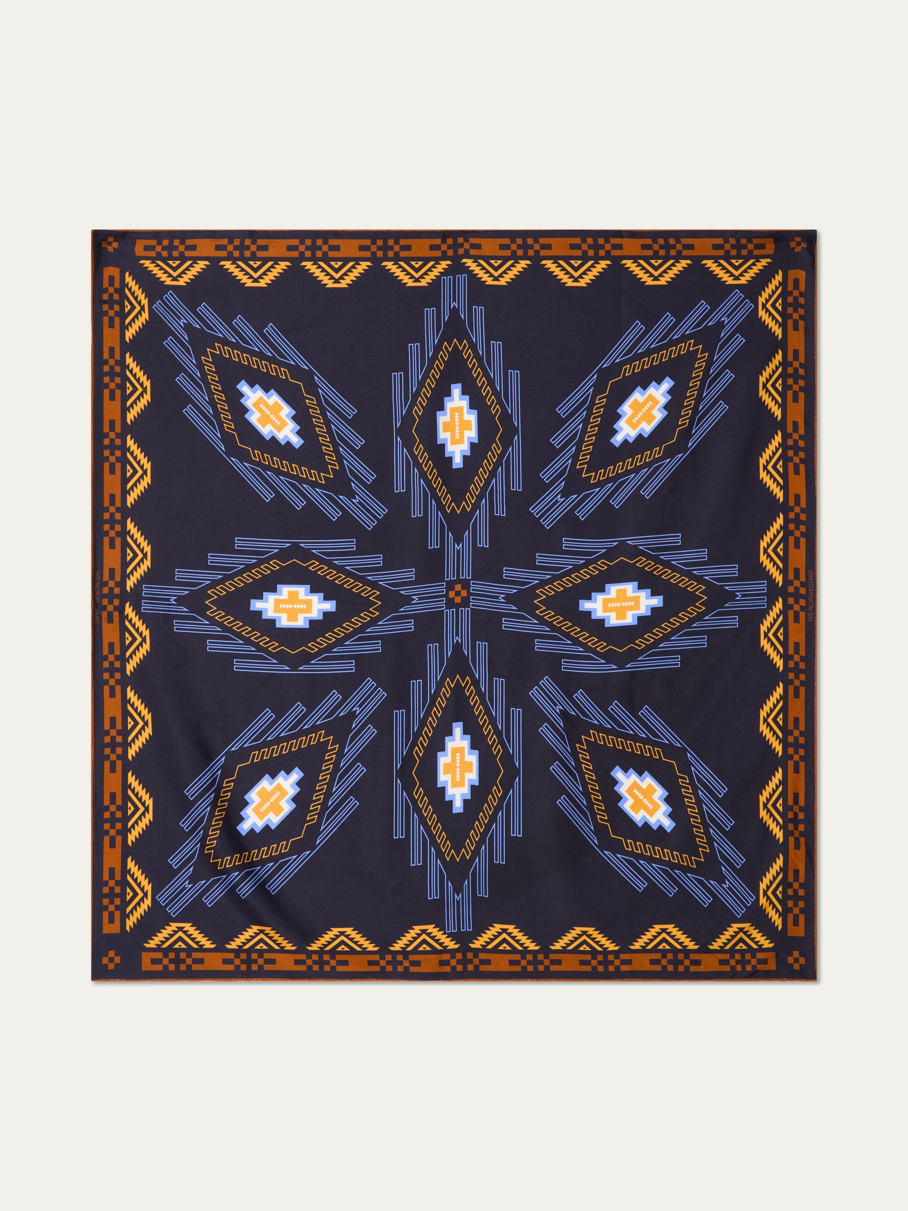 We Norwegians | FW25 | Pioneer Silk Scarf_Navy blue | Scarf with printed motifs inspired by Indigenous American art | Shot against an off-white background