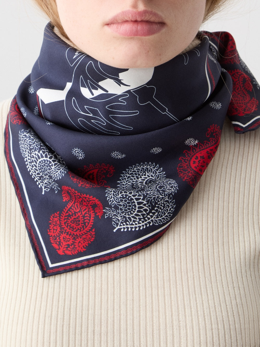 We Norwegians | FW25 | A female model is wearing the Western silk scarf_Navy blue | Printed with paisley patterns and a center stag motif