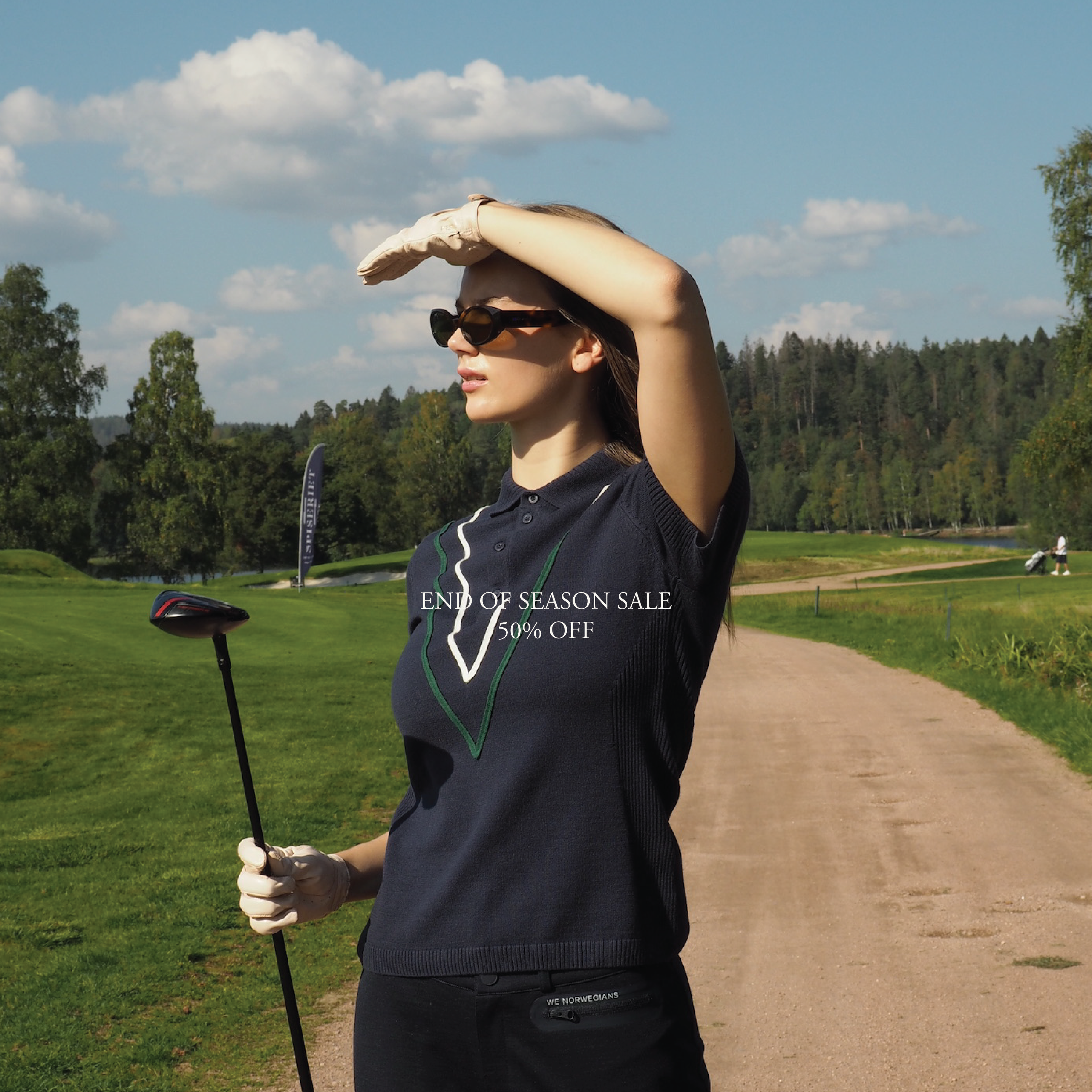 We Norwegians_SS25_Womenswear_ Model is wearing Team Chevron Polo_Navy Blue