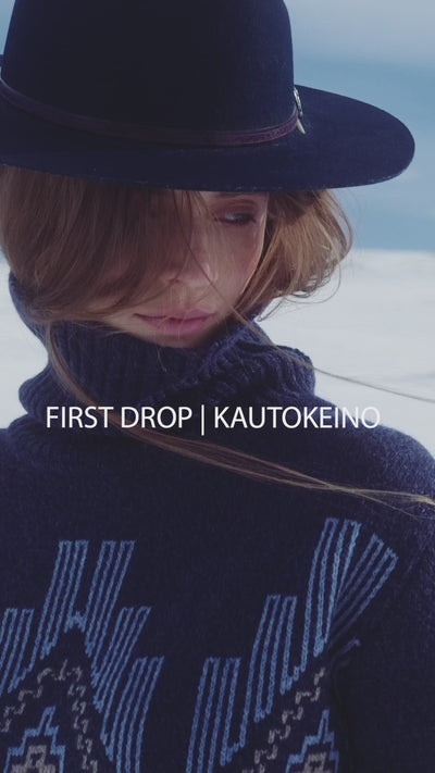 We Norwegians_FW25_Women | Model is wearing KAutokeino sweater in navy blue | Featuring the garment in snowy Geilo, Norway